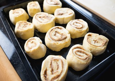 Homemade Cinnamon Rolls Shaped Pieces On Baking Plate