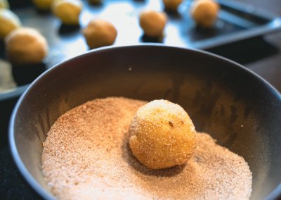 Soft Pumpkin Snickerdoodles Rolling Dough In Pumpkin Spice Sugar Mixture
